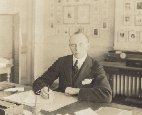 Lord Berwick at a desk taken between 1900 and 1919.